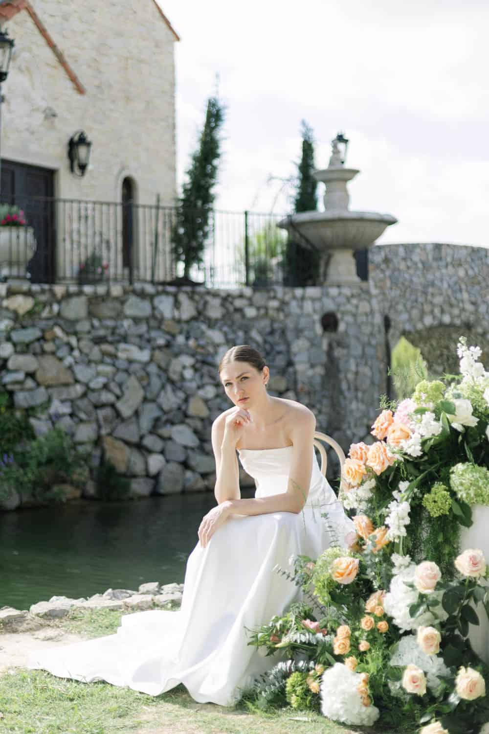 Bridal bouquet with white and peach roses, hydrangeas, and greenery for wedding flowers.