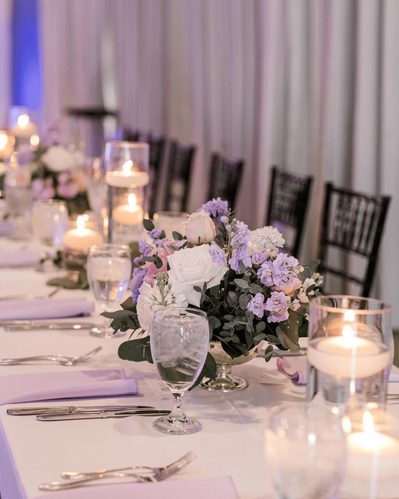 Beautiful floral arrangement featuring roses and lavender for wedding decor.