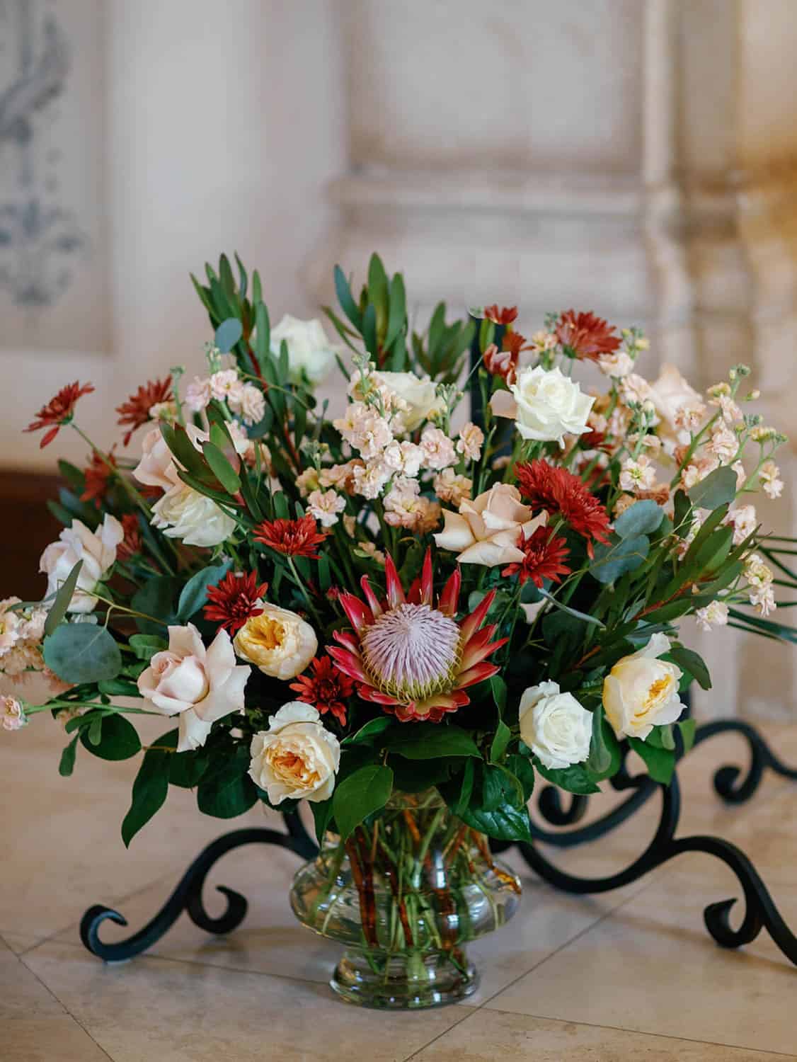 Beautiful floral arrangement with roses and protea.