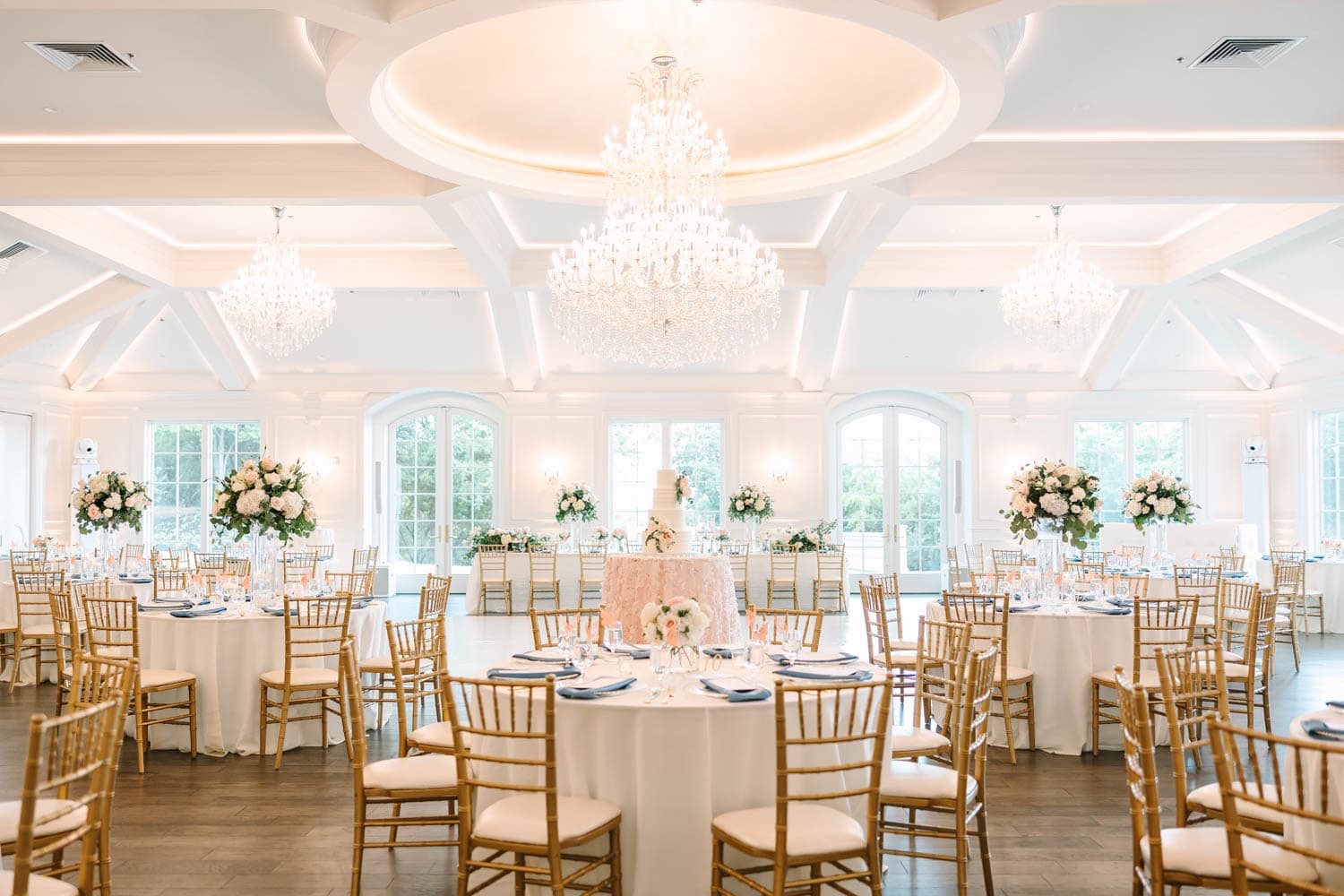 Wedding reception floral arrangements with elegant flowers and decor.