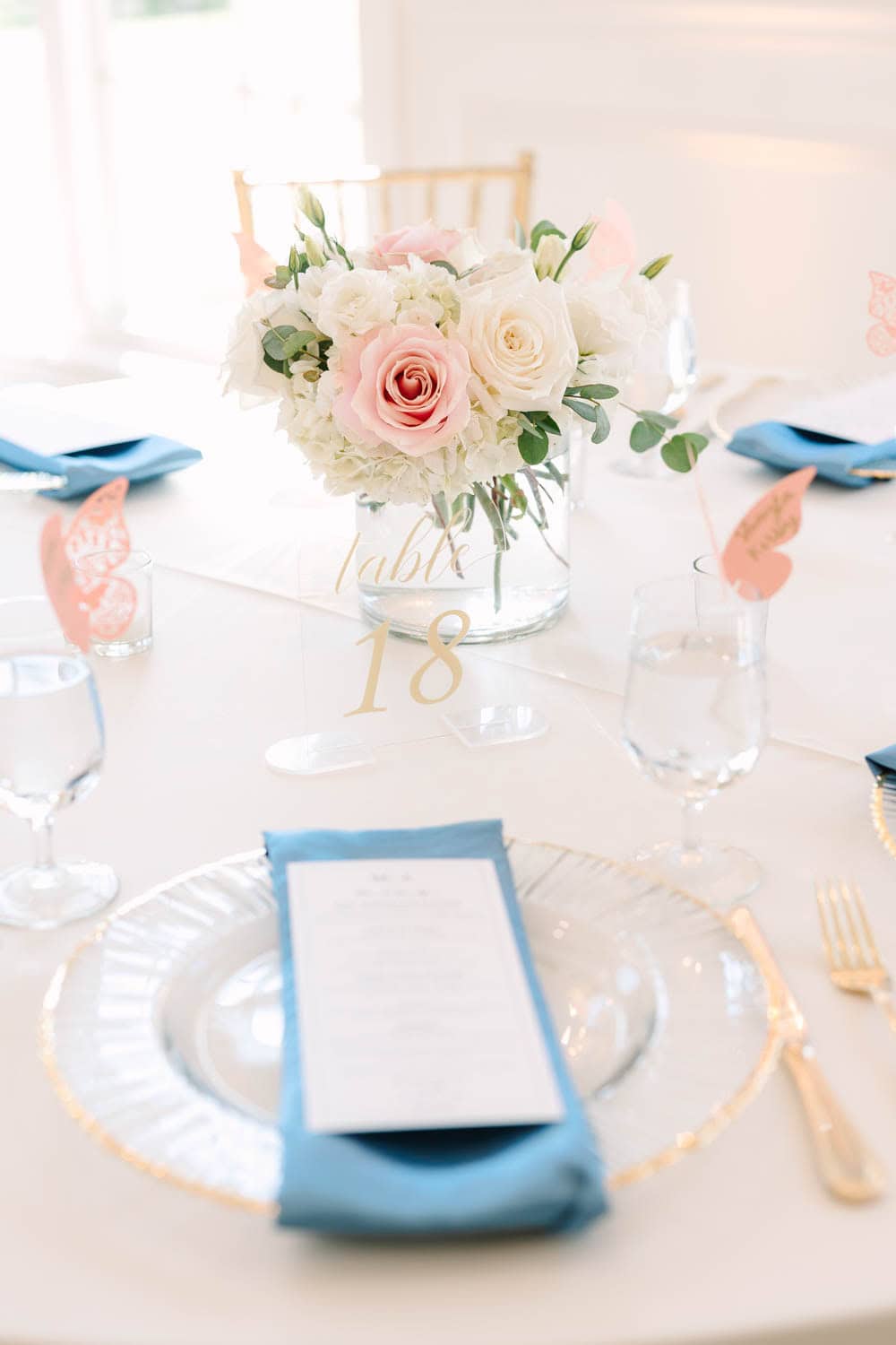 Beautiful wedding flower arrangement with roses and greenery.